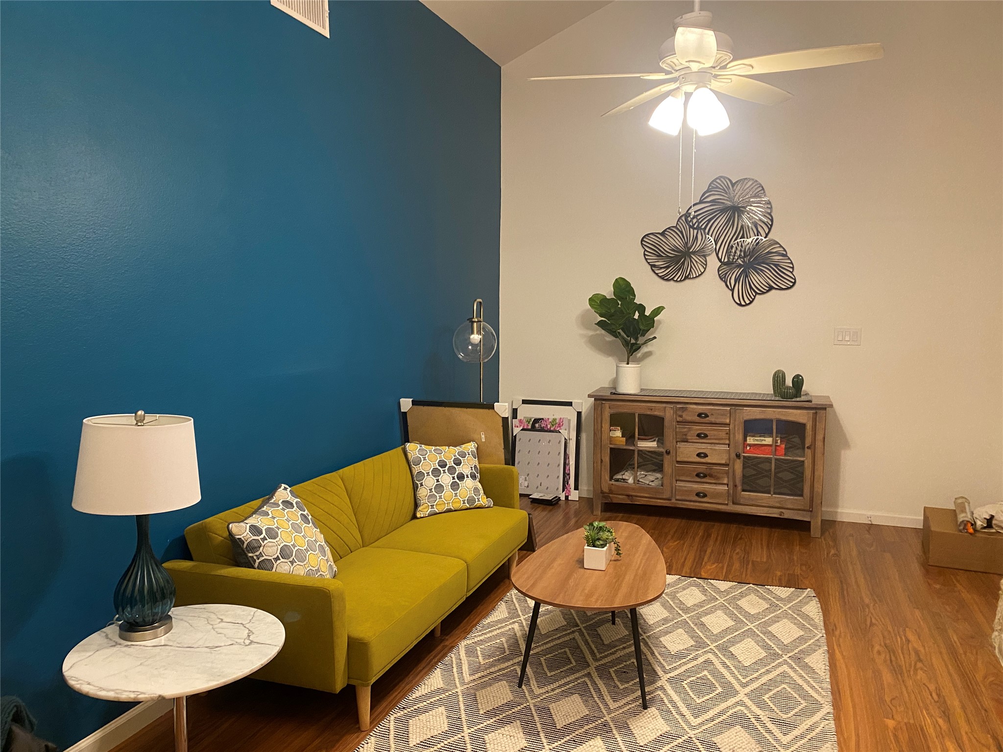 5405 Brompton Circle, Unit B Austin, TX 78745 - Photo 17 of 19 Living room with ceiling fan, vaulted ceiling, and wood finished floors