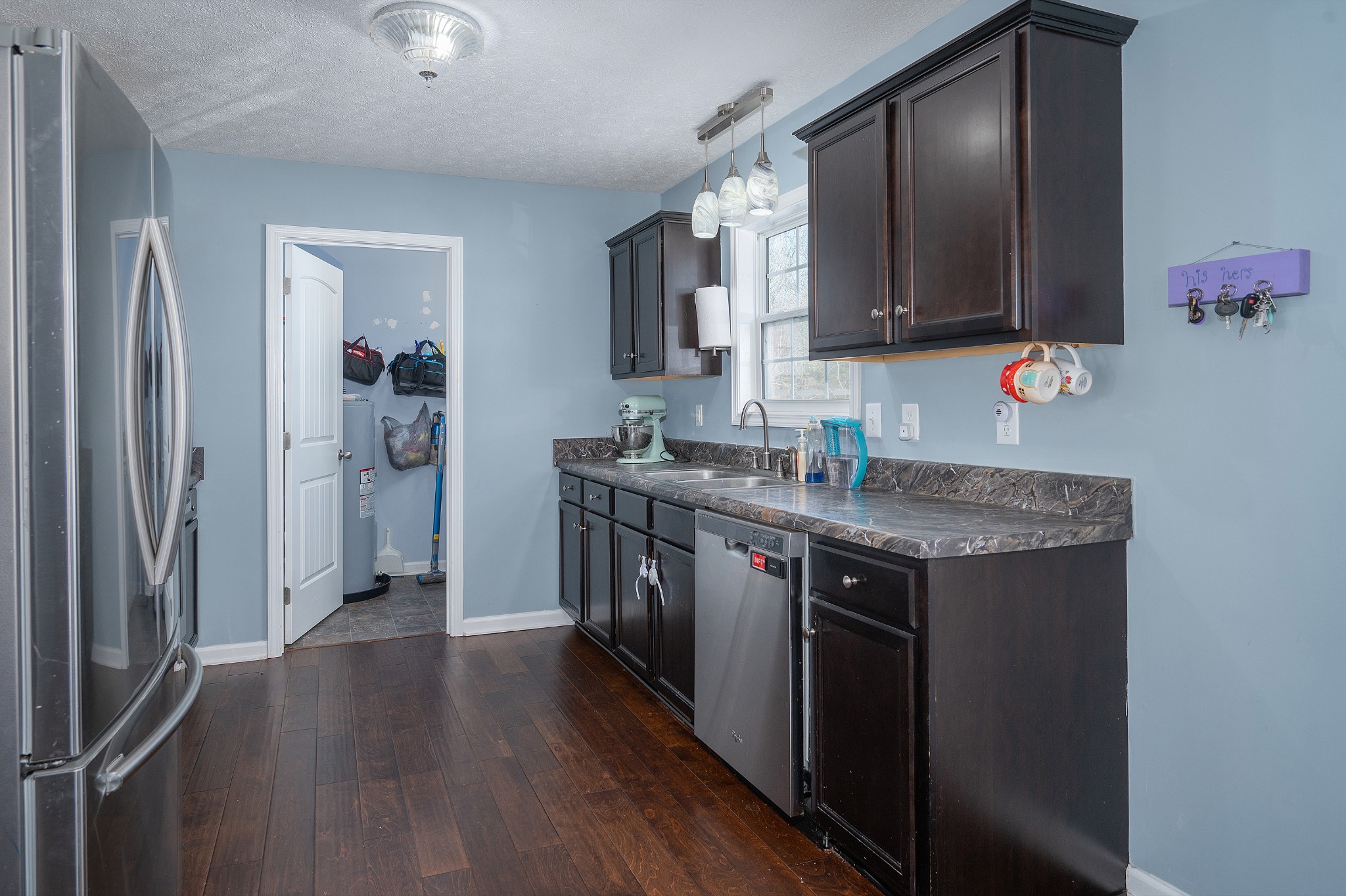 2995 Oak Grove Church Road Bethpage, TN 37022 - Photo 7 of 28 a kitchen with stainless steel appliances granite countertop a sink stove and refrigerator
