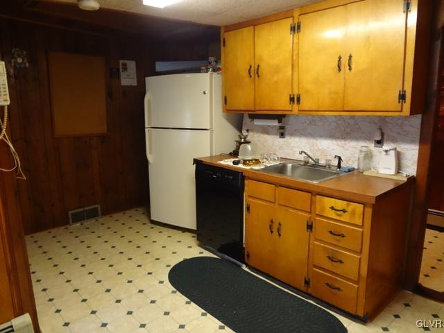 2436 Mountain Road Stroudsburg, PA 18360 - Photo 8 of 34 a kitchen with a refrigerator sink and cabinets