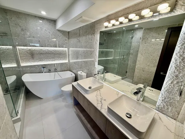 a bathroom with a bathtub and a sink