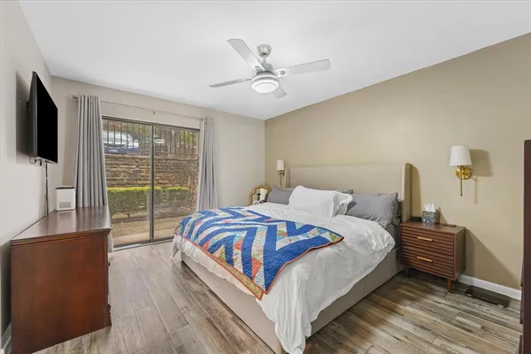 a bedroom with a bed and a window