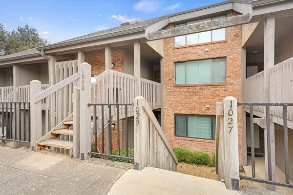 a view of a house with wooden floor and a large window