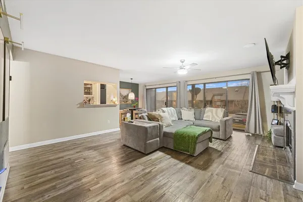 a living room with furniture and a large window