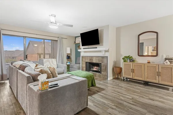a living room with furniture fireplace and flat screen tv