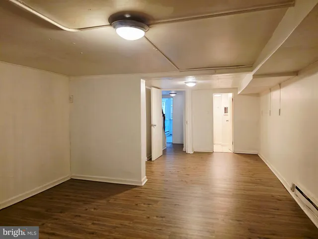 a view of a livingroom with wooden floor