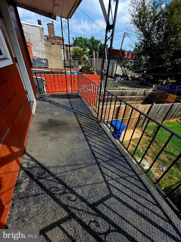 a view of balcony with wooden floor
