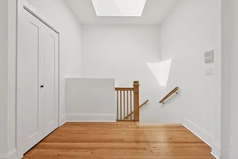 a view of an empty room with stairs