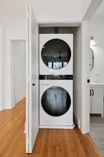 a living room with a washer and dryer