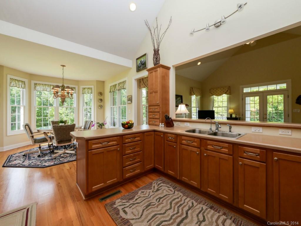 450 Old Carriage Road Clover, SC 29710 - Photo 19 of 23 a large kitchen with kitchen island granite countertop a sink and dishwasher wooden floor