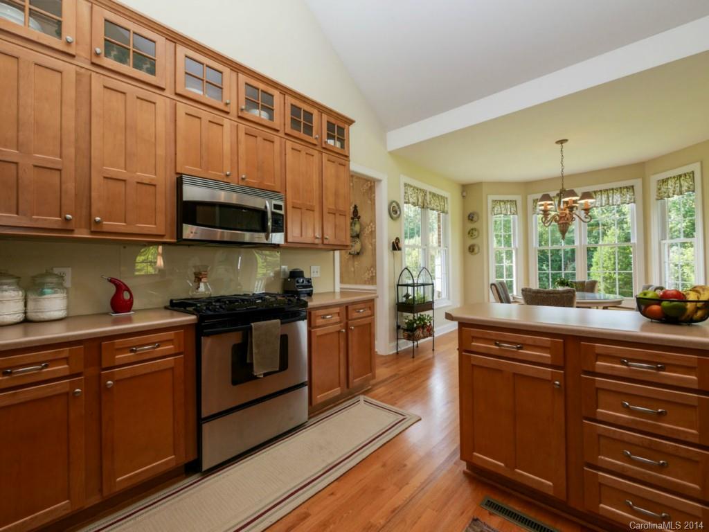 450 Old Carriage Road Clover, SC 29710 - Photo 20 of 23 a kitchen with stainless steel appliances granite countertop a stove a sink and a microwave