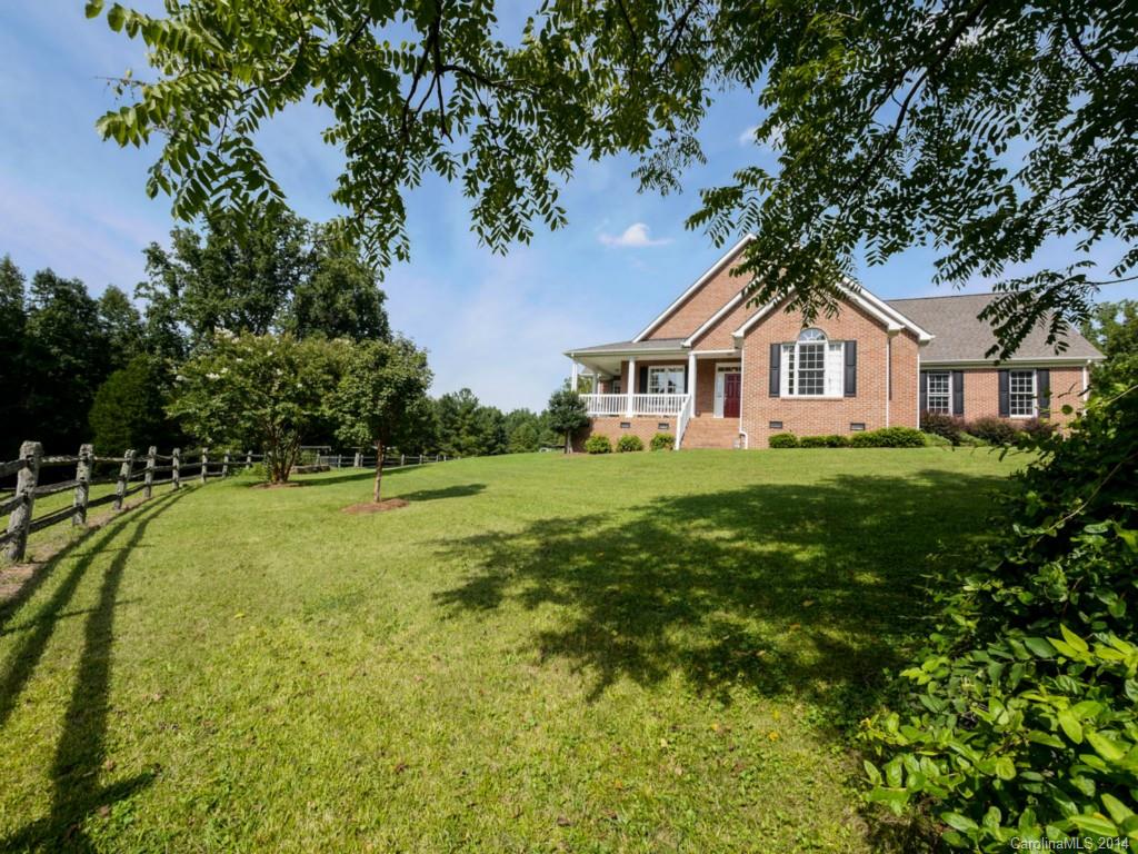 450 Old Carriage Road Clover, SC 29710 - Photo 3 of 23 a front view of a house with yard and green space