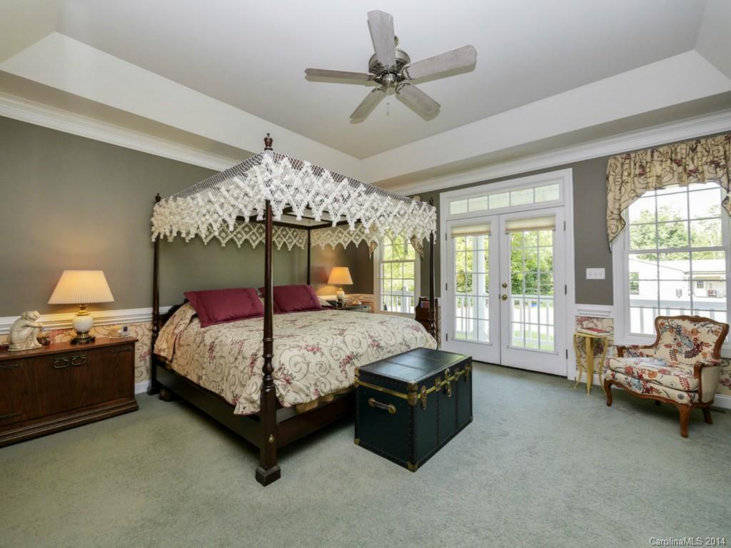 450 Old Carriage Road Clover, SC 29710 - Photo 8 of 23 a bed room with a bed and a chair