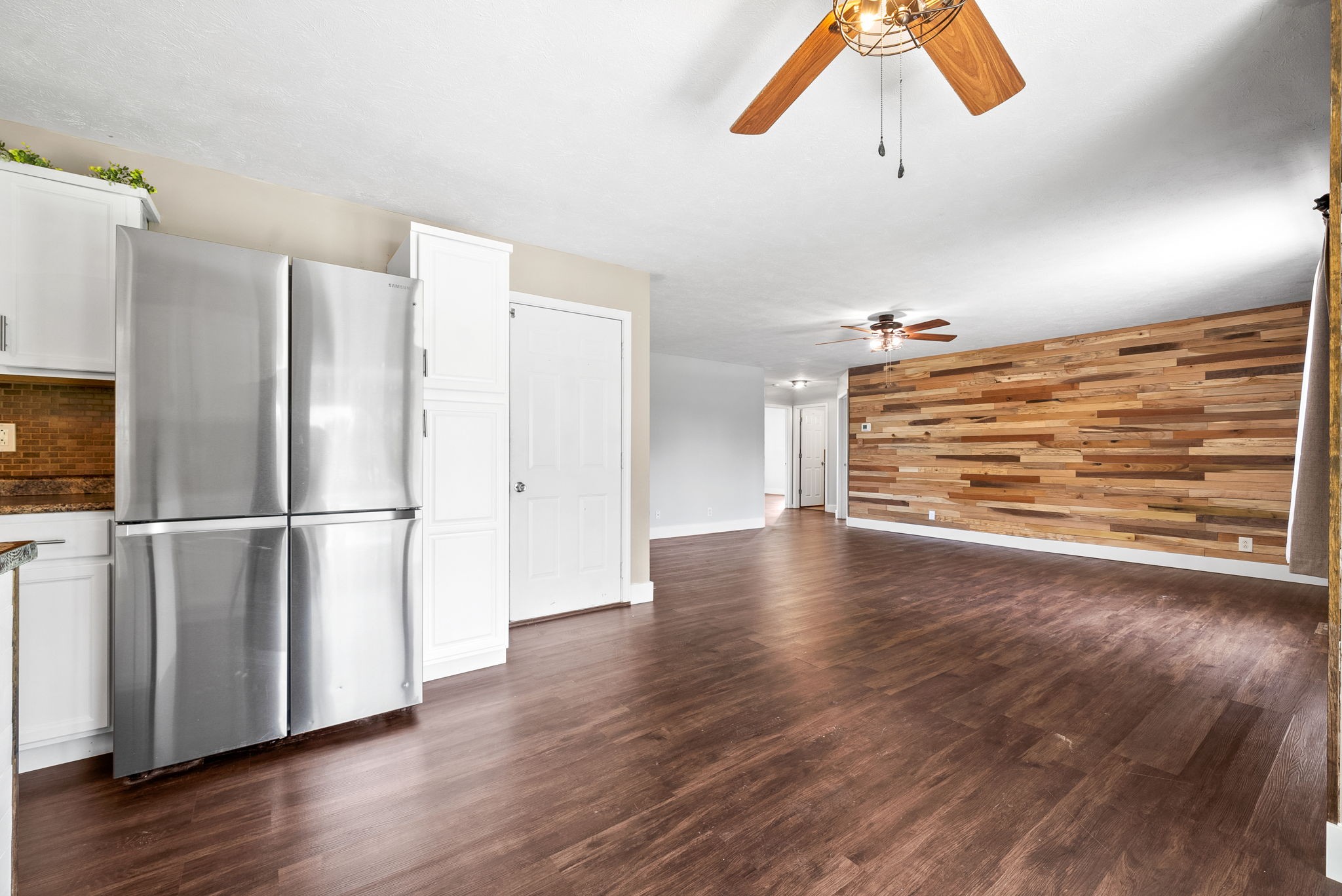 10383 Bell Station Road Oak Grove, KY 42262 - Photo 15 of 33 a view of a refrigerator in kitchen and wooden floor