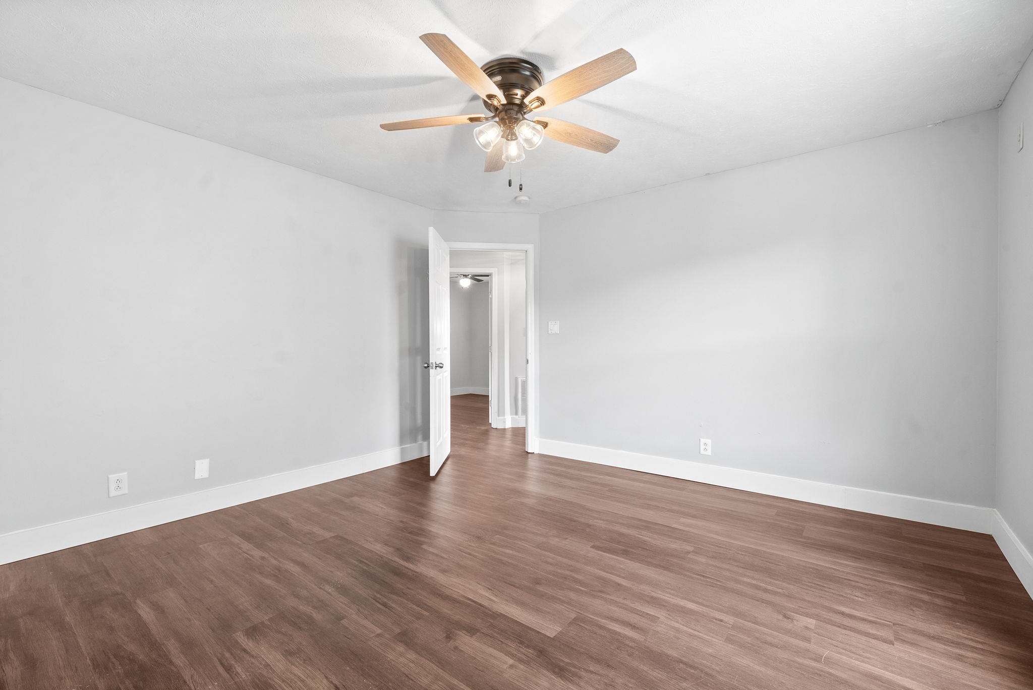 10383 Bell Station Road Oak Grove, KY 42262 - Photo 18 of 33 a view of an empty room with wooden floor