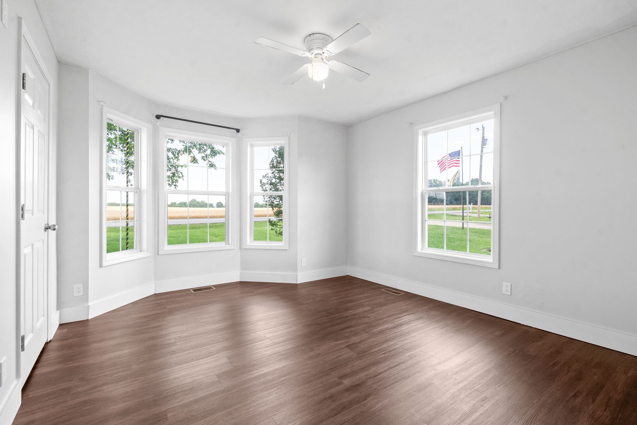 10383 Bell Station Road Oak Grove, KY 42262 - Photo 21 of 33 a view of an empty room with wooden floor and a window