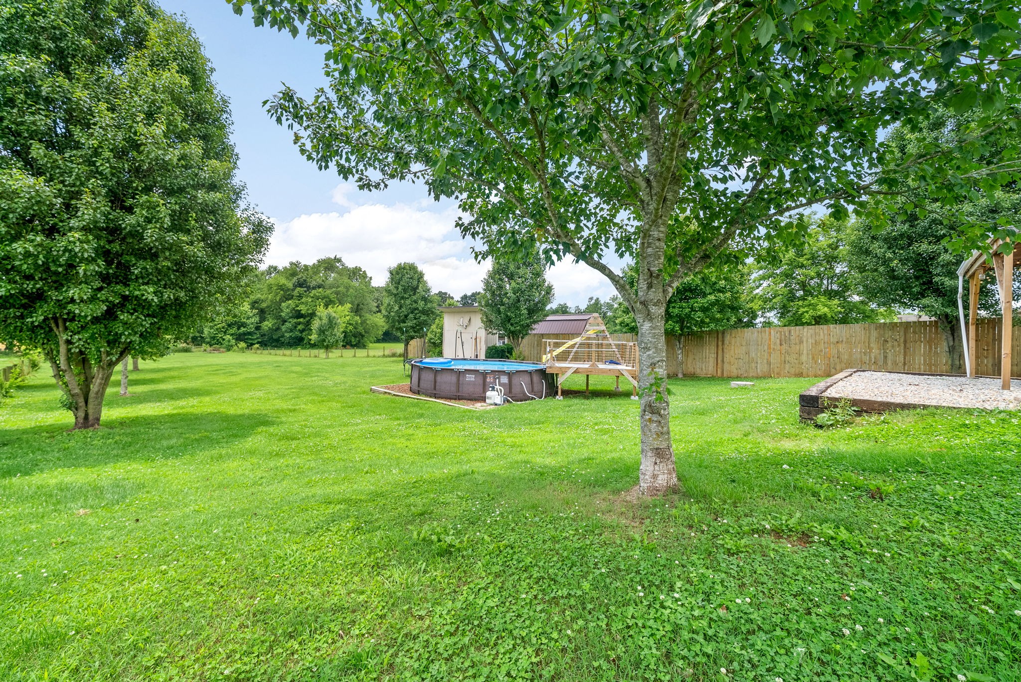10383 Bell Station Road Oak Grove, KY 42262 - Photo 28 of 33 a view of a house with backyard and a slide