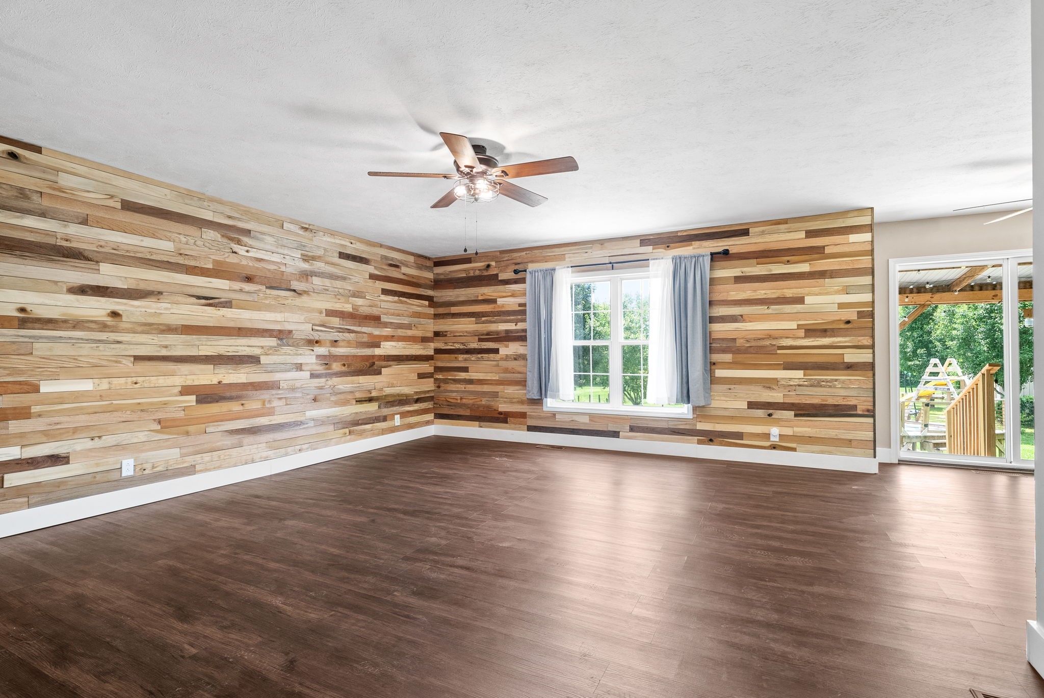 10383 Bell Station Road Oak Grove, KY 42262 - Photo 7 of 33 a view of empty room with wooden floor and fan
