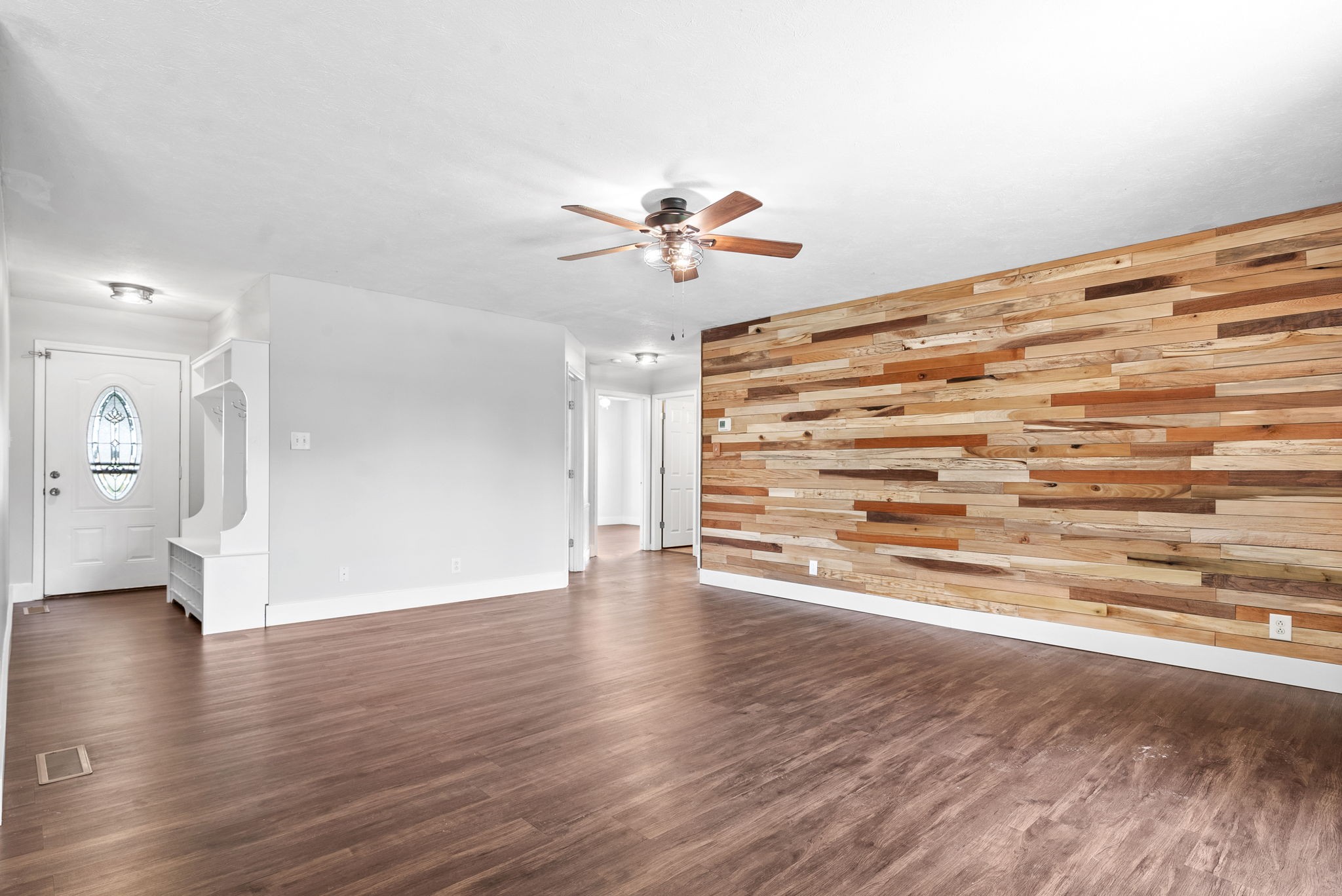 10383 Bell Station Road Oak Grove, KY 42262 - Photo 9 of 33 a view of a livingroom with wooden floor and a ceiling fan