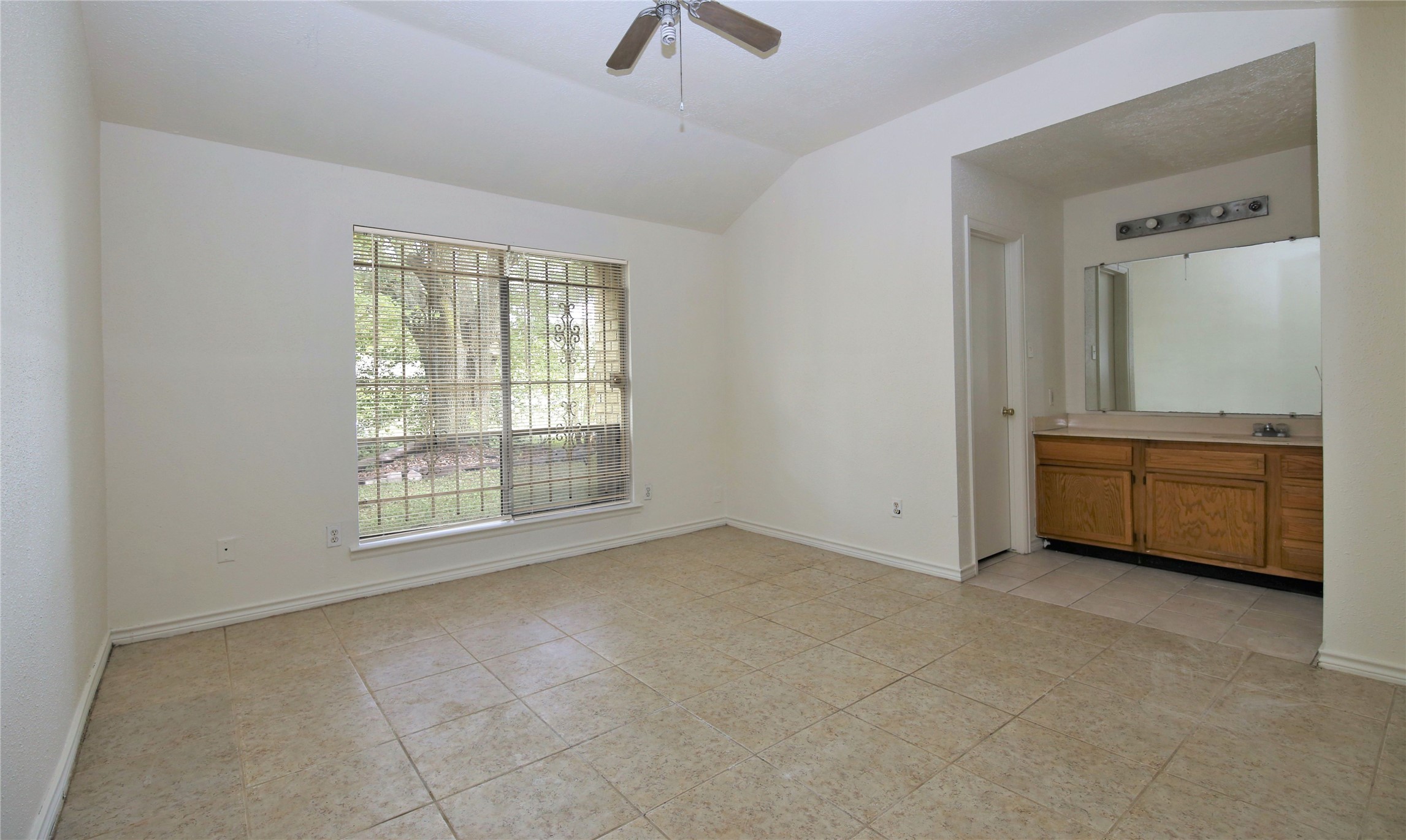 14211 Timberhaven Drive Houston, TX 77066 - Photo 11 of 19 a view of an empty room with a window