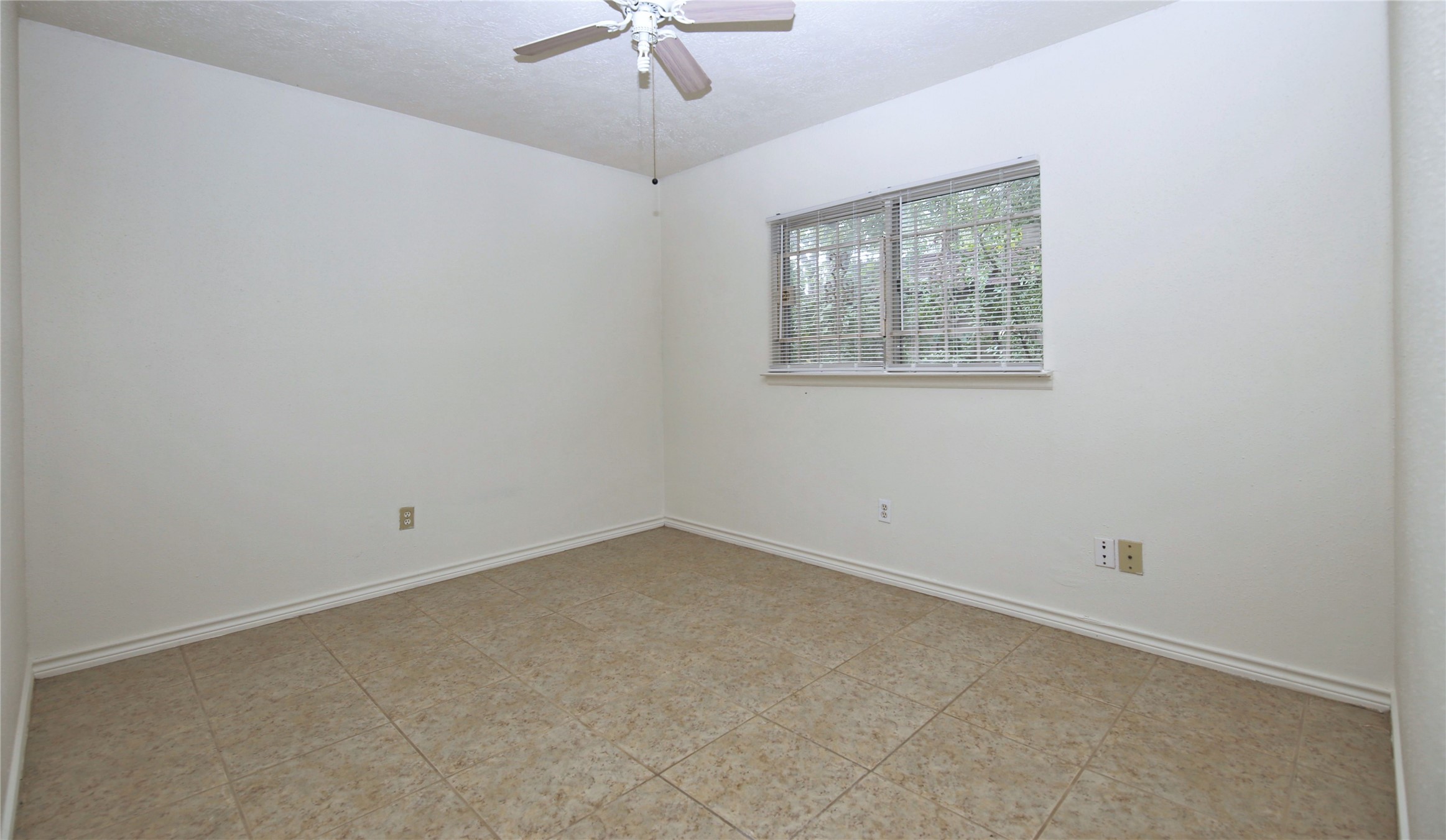14211 Timberhaven Drive Houston, TX 77066 - Photo 15 of 19 an empty room with a window