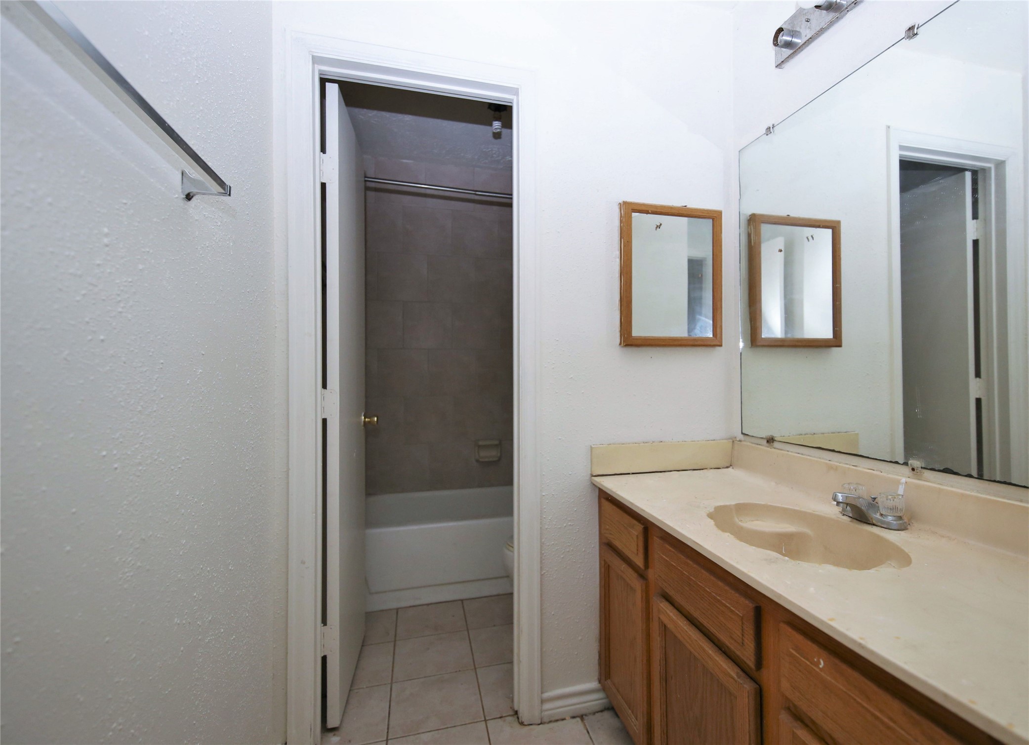 14211 Timberhaven Drive Houston, TX 77066 - Photo 19 of 19 a bathroom with a sink and a mirror