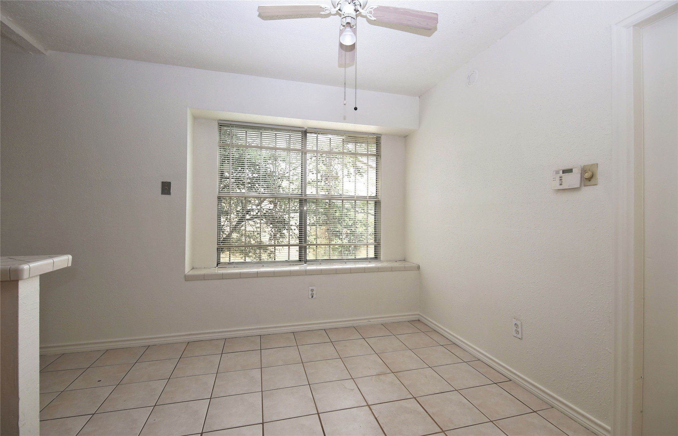 14211 Timberhaven Drive Houston, TX 77066 - Photo 8 of 19 a view of an empty room with a window