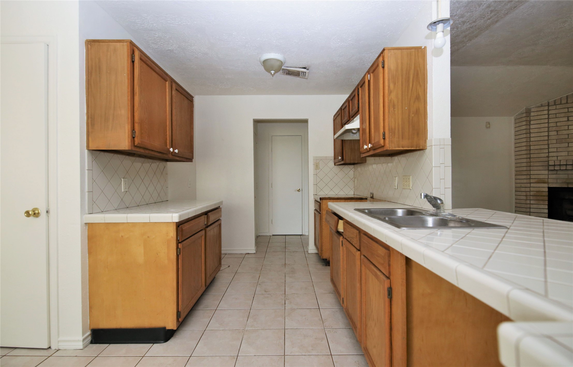14211 Timberhaven Drive Houston, TX 77066 - Photo 9 of 19 a kitchen with stainless steel appliances granite countertop a sink and a stove