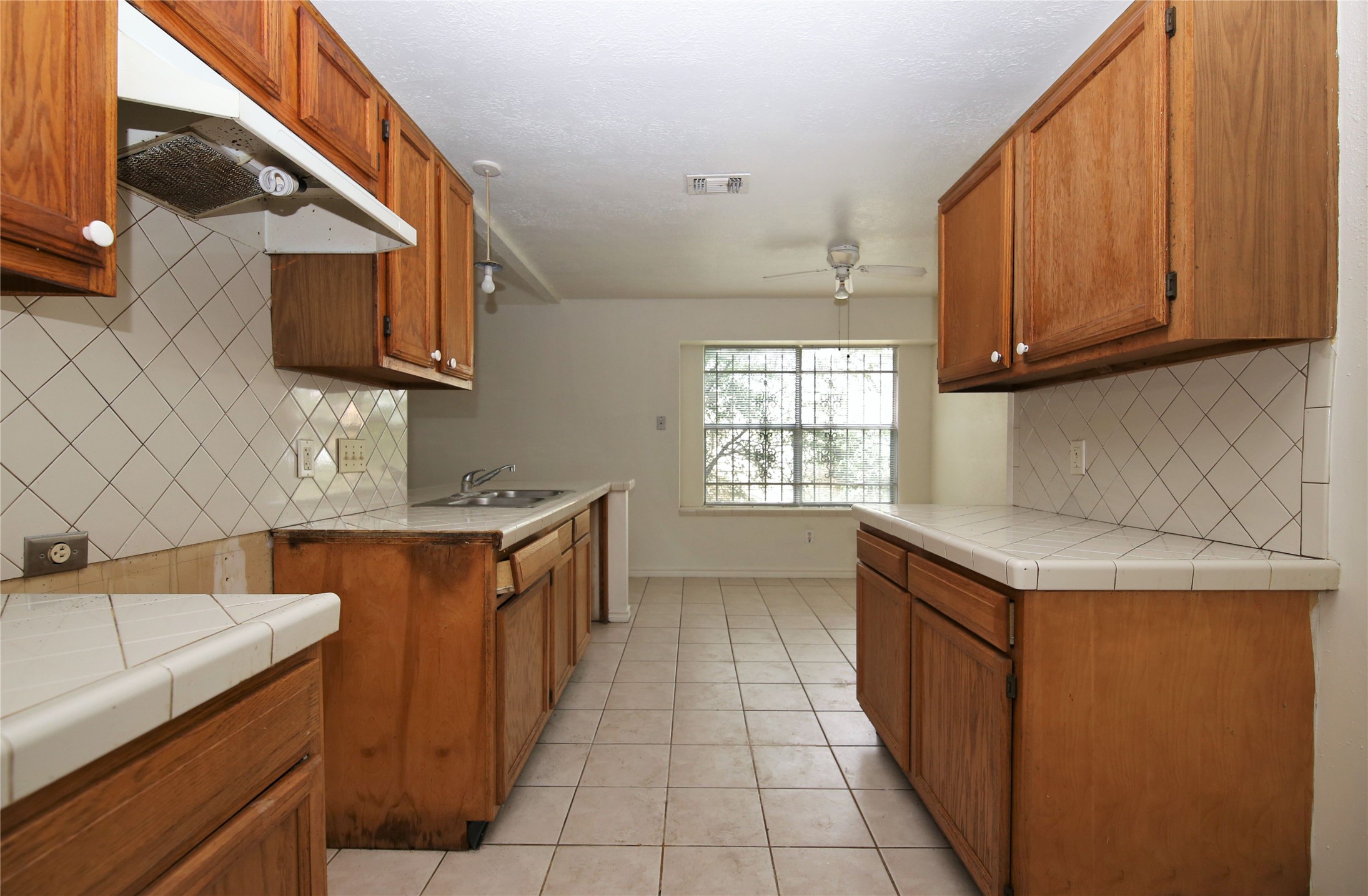 14211 Timberhaven Drive Houston, TX 77066 - Photo 10 of 19 a kitchen with stainless steel appliances granite countertop a sink stove and cabinets