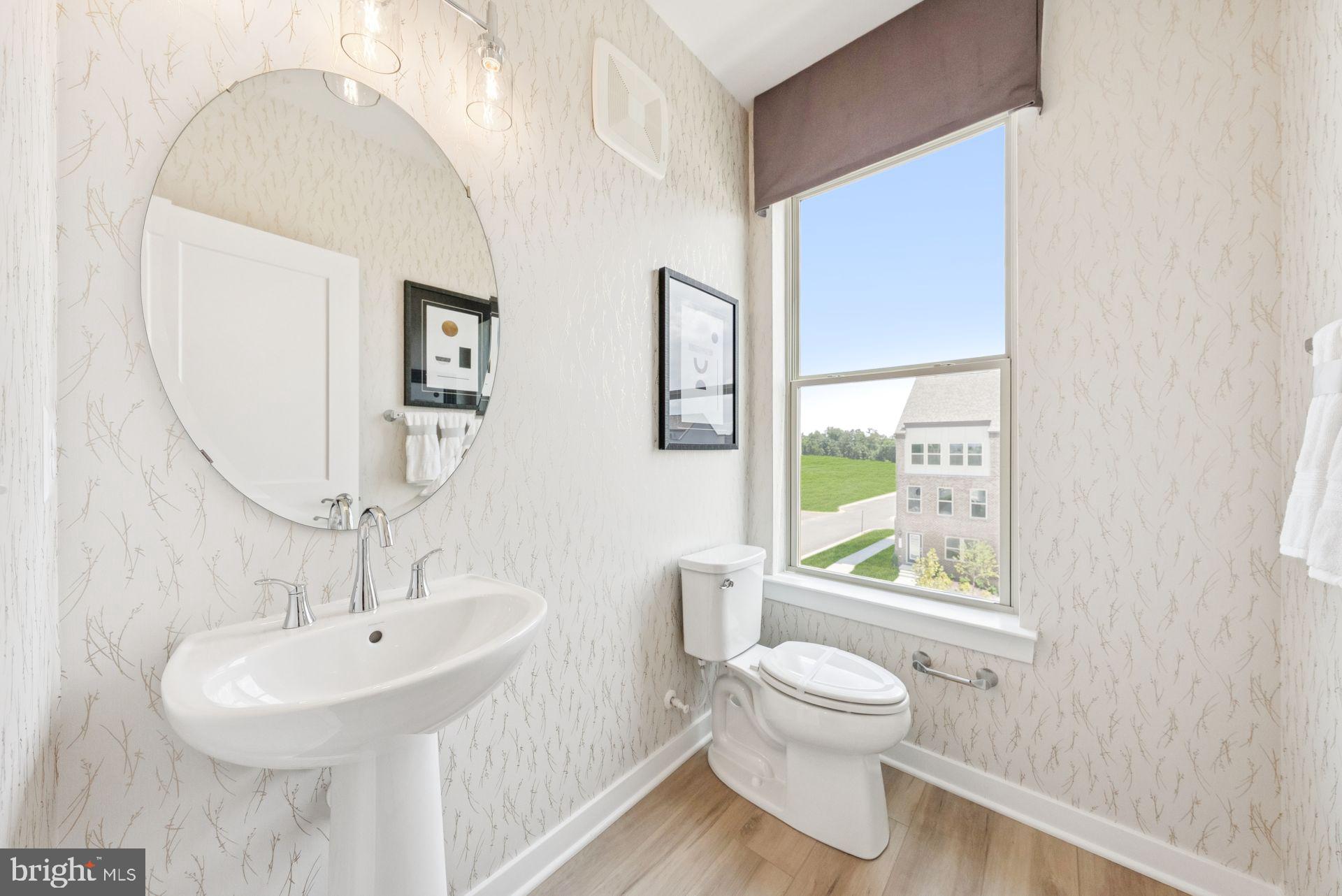 13713 Cobble Loop Woodbridge, VA 22193 - Photo 11 of 27 a bathroom with a toilet a sink and a mirror