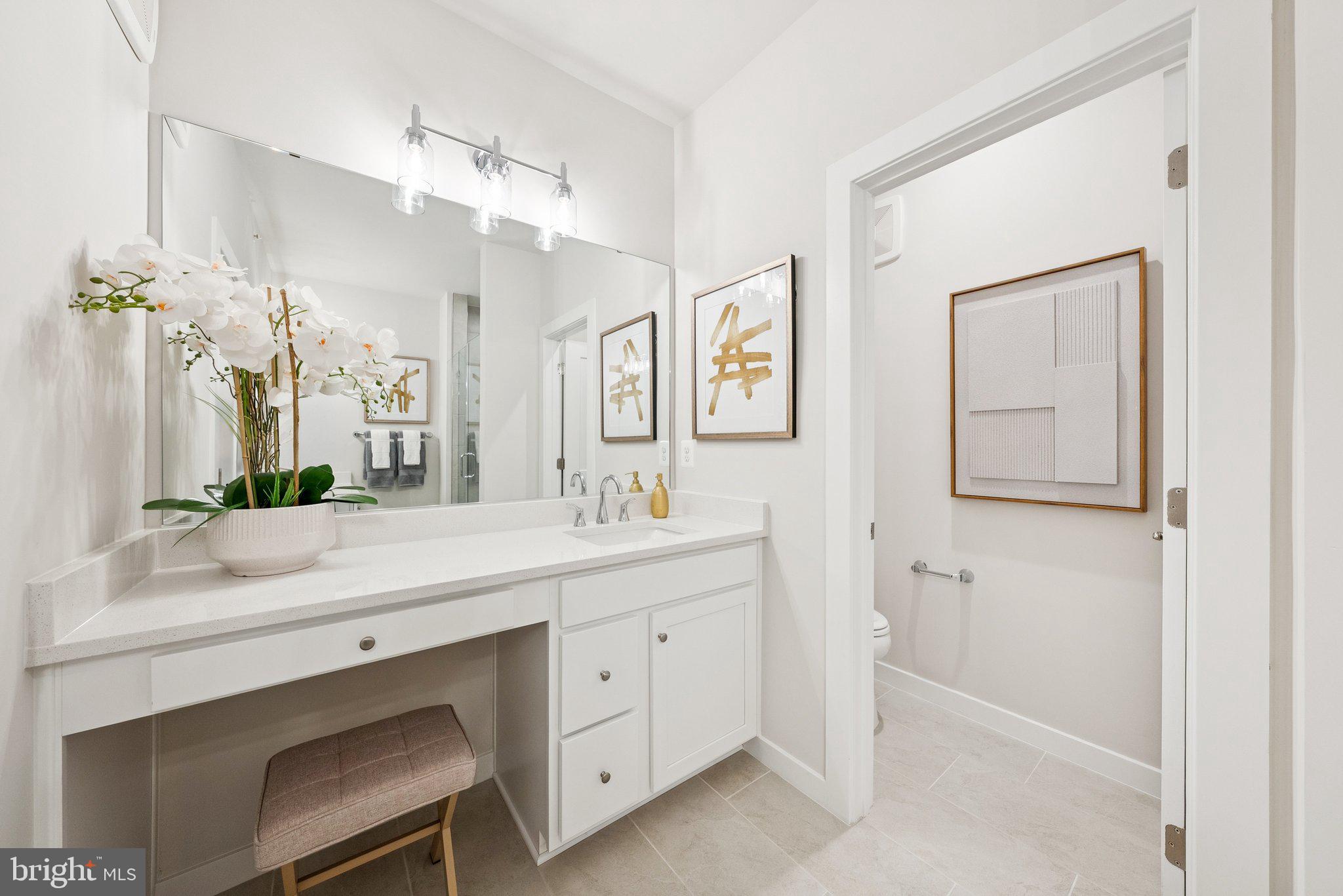 13713 Cobble Loop Woodbridge, VA 22193 - Photo 17 of 27 a spacious bathroom with a double vanity sink mirror and