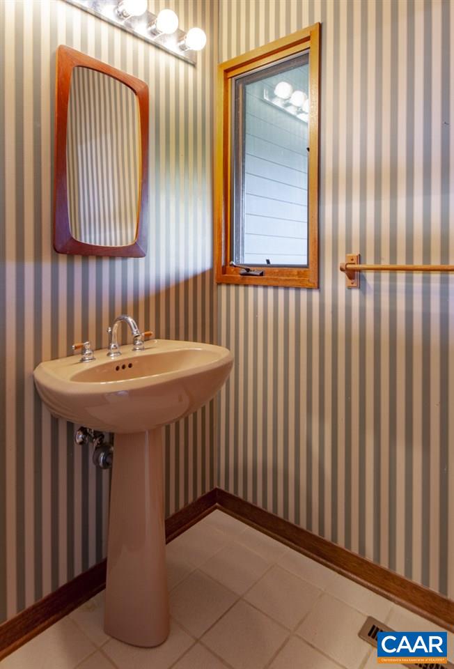 2900 Riggory Ridge Road Charlottesville, VA 22911 - Photo 15 of 44 a bathroom with a sink and a mirror