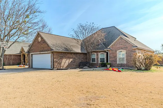 a view of a house with snow on the road
