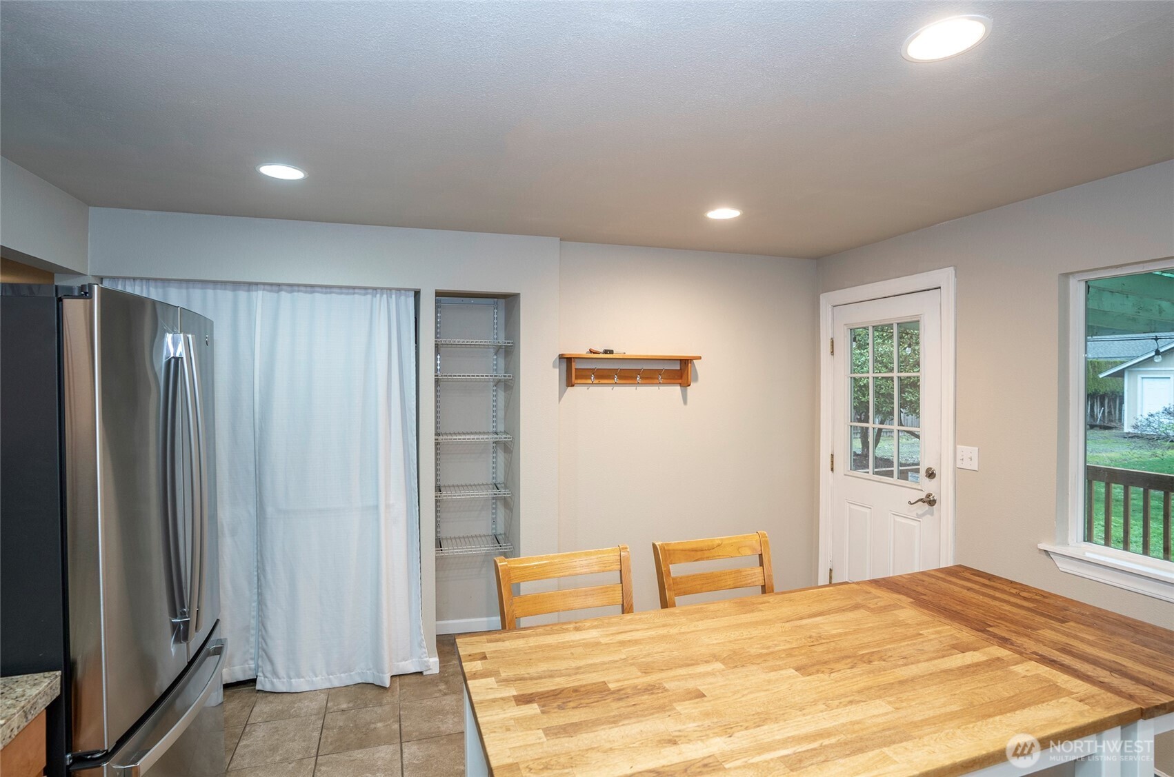 407 18th Street Southwest Puyallup, WA 98371 - Photo 12 of 40 a bedroom with a bed and a window