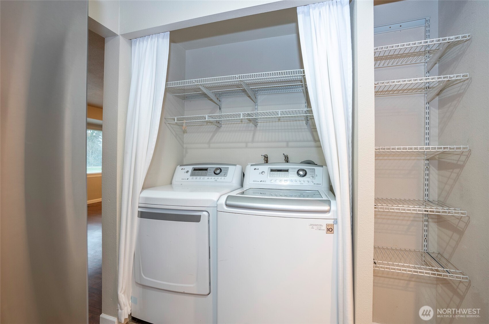 407 18th Street Southwest Puyallup, WA 98371 - Photo 14 of 40 a utility room with dryer and washer