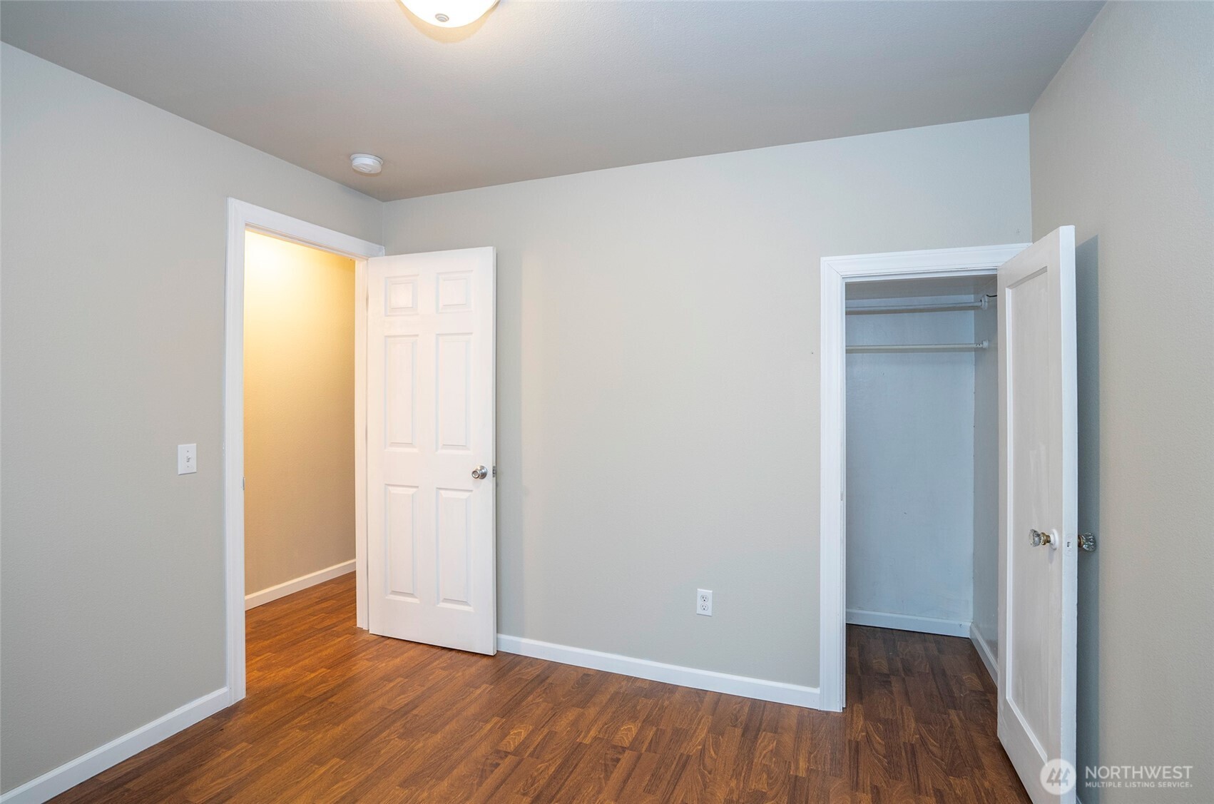 407 18th Street Southwest Puyallup, WA 98371 - Photo 17 of 40 a view of an empty room with wooden floor