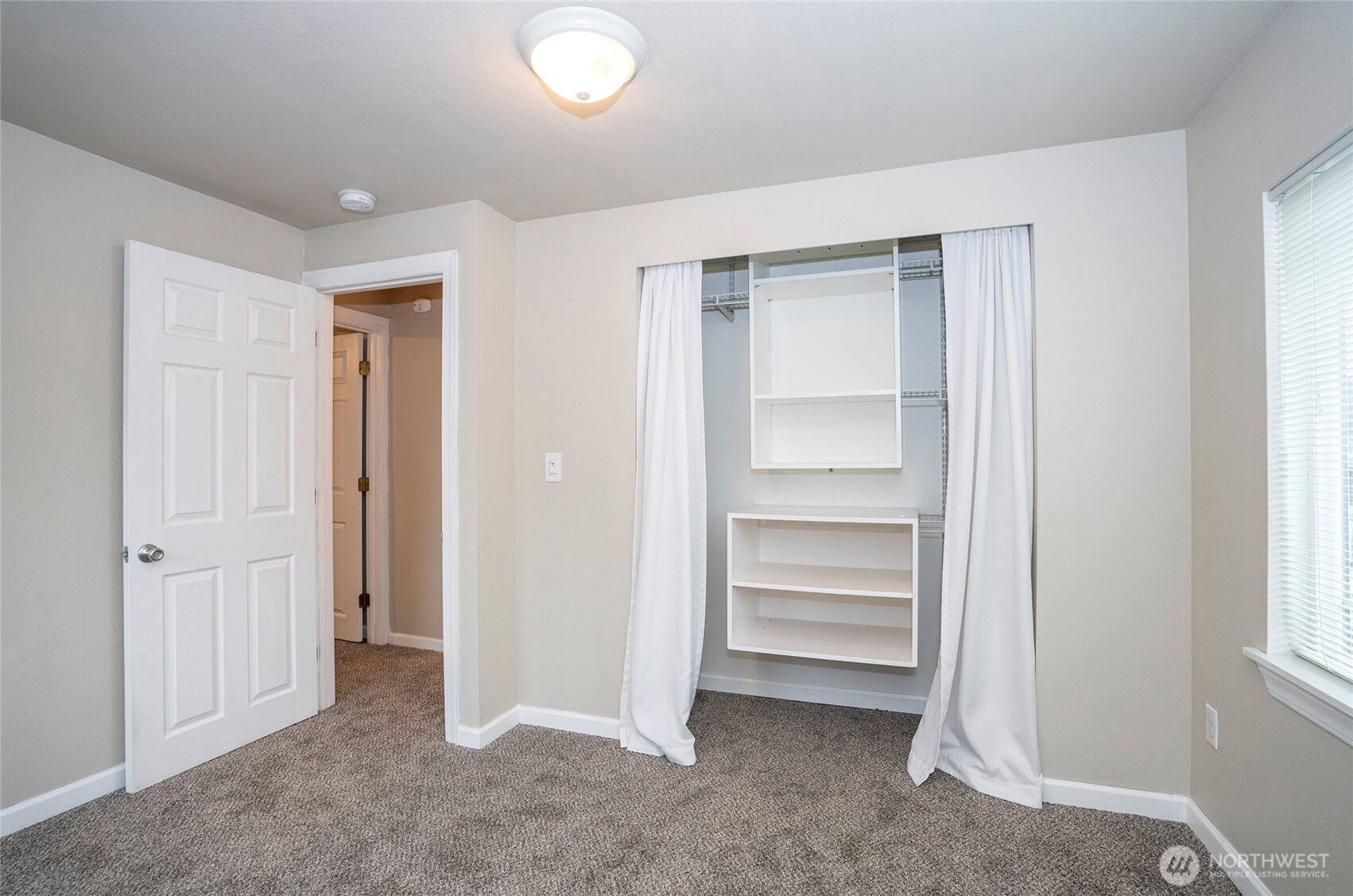 407 18th Street Southwest Puyallup, WA 98371 - Photo 25 of 40 a view of an empty room and a windows