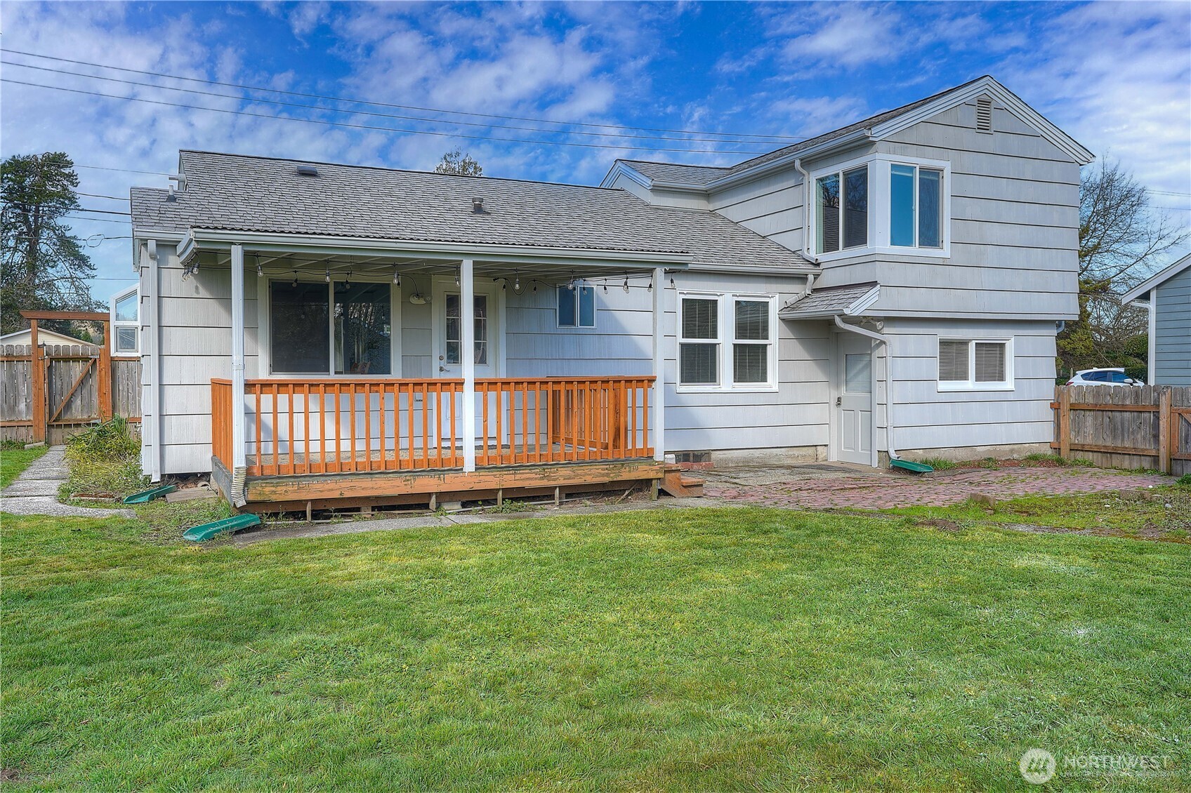 407 18th Street Southwest Puyallup, WA 98371 - Photo 29 of 40 a view of a house with a yard and a large window