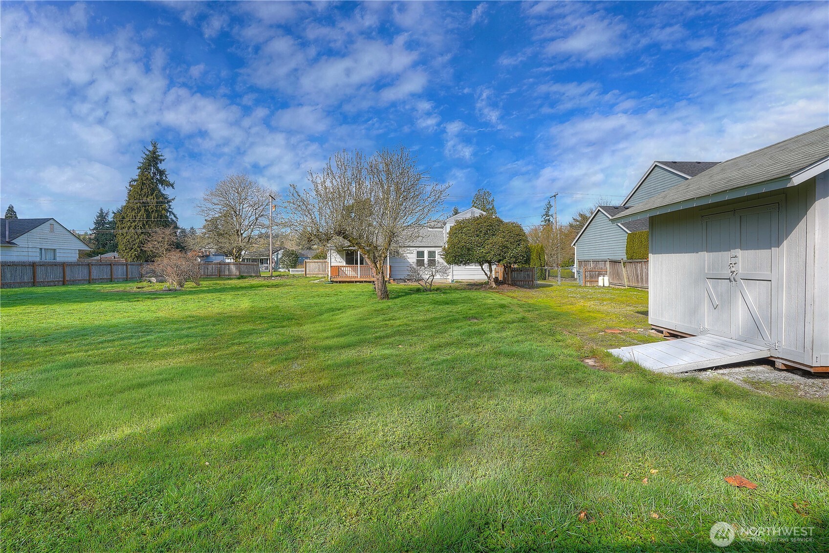 407 18th Street Southwest Puyallup, WA 98371 - Photo 31 of 40 a view of a house with a yard