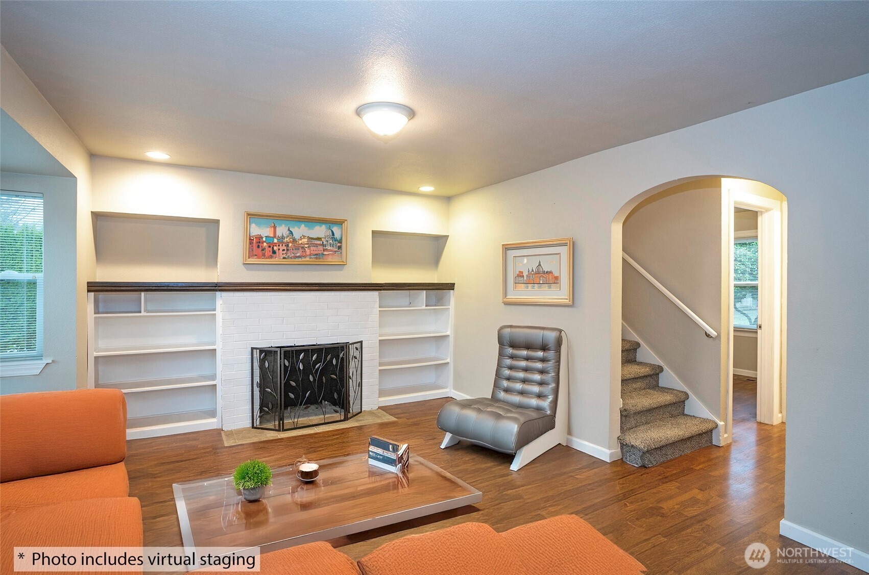 407 18th Street Southwest Puyallup, WA 98371 - Photo 6 of 40 a living room with furniture and a fireplace