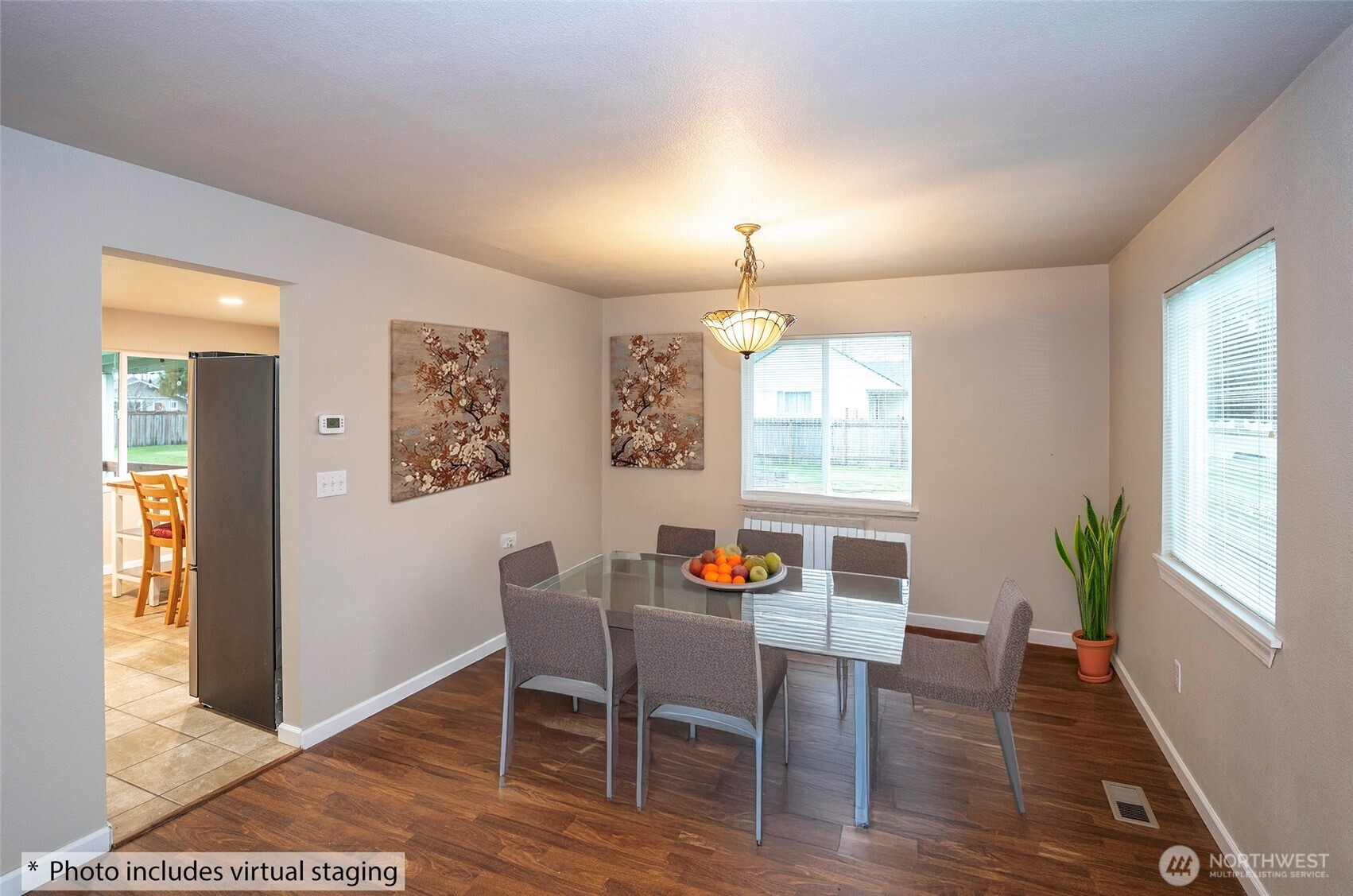 407 18th Street Southwest Puyallup, WA 98371 - Photo 7 of 40 a view of a dining room with furniture window and wooden floor