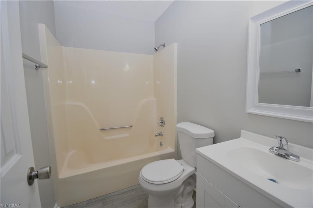 7211 Mason Road Climax, NC 27233 - Photo 12 of 31 The primary bedrooms private en-suite. No more sharing with the rest of the house!!