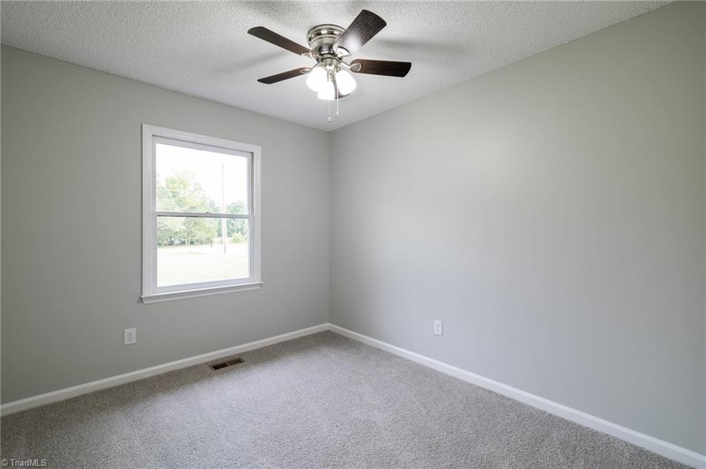 7211 Mason Road Climax, NC 27233 - Photo 13 of 31 First guest bedroom with upgrade ceiling fan.