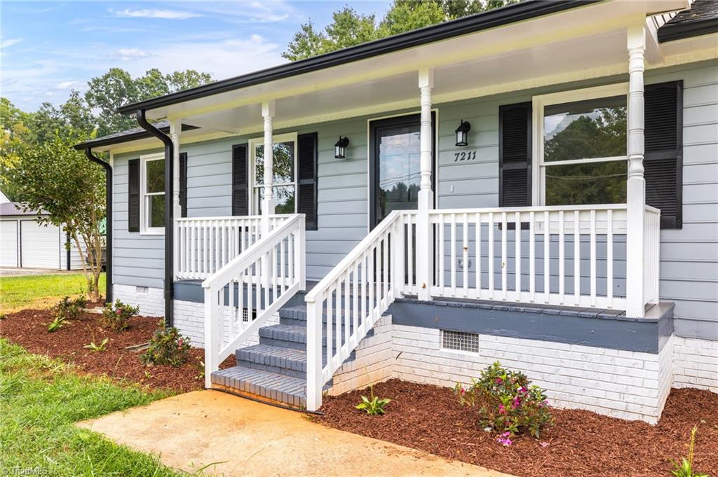 7211 Mason Road Climax, NC 27233 - Photo 2 of 31 The covered rocking chair front porch is perfect for sitting back and relaxing
