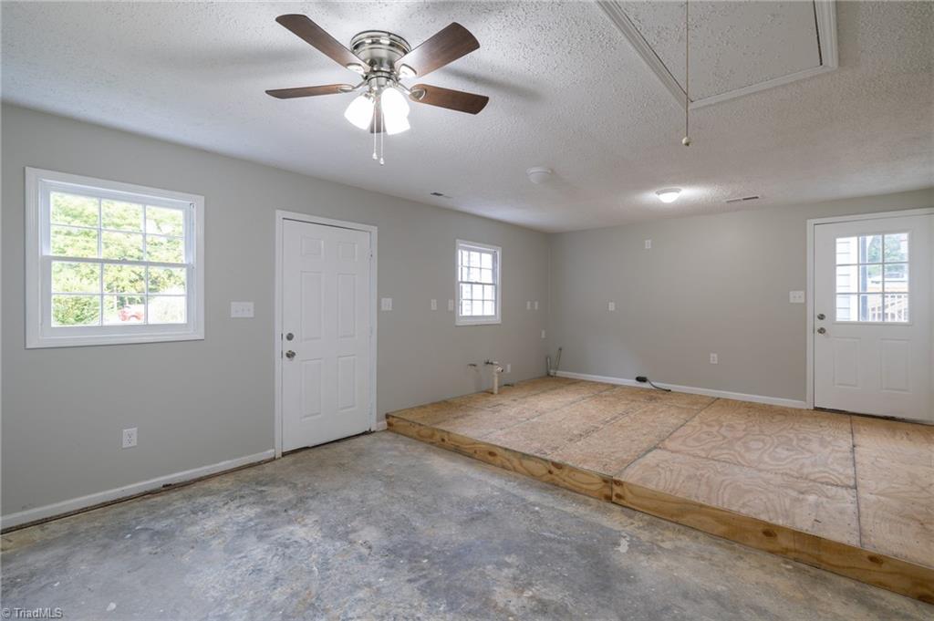 7211 Mason Road Climax, NC 27233 - Photo 27 of 31 A view inside the converted garage of what was to become the kitchen area.