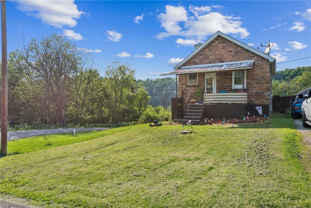 375 Reduction Road Smithton, PA 15479 - Photo 21 of 30 a front view of a house with a yard