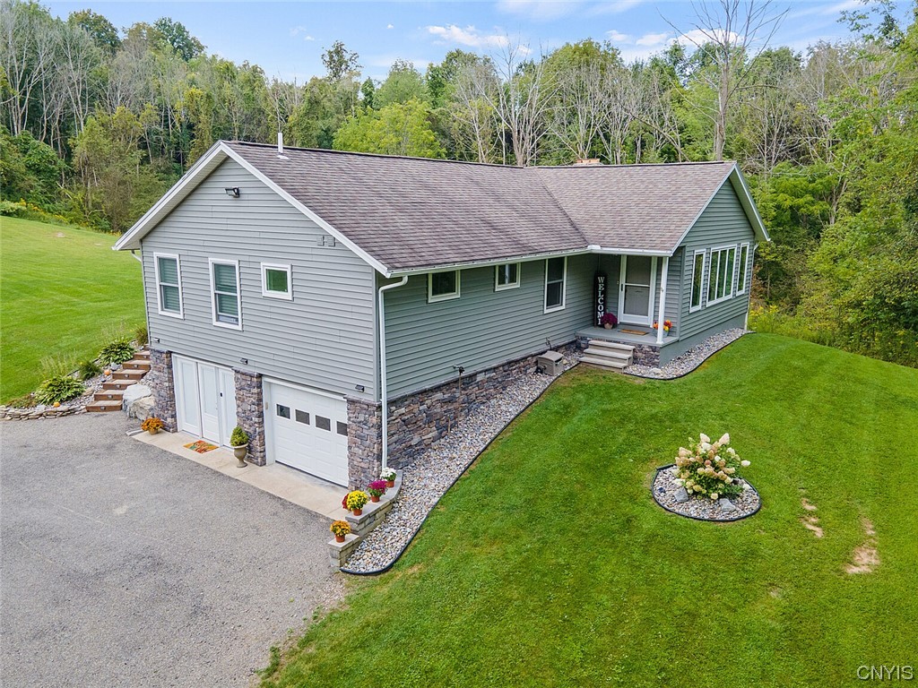 6179 Olmstead Road Sullivan, NY 13037 - Photo 1 of 1 Drone shot of front of home showing garage entranc