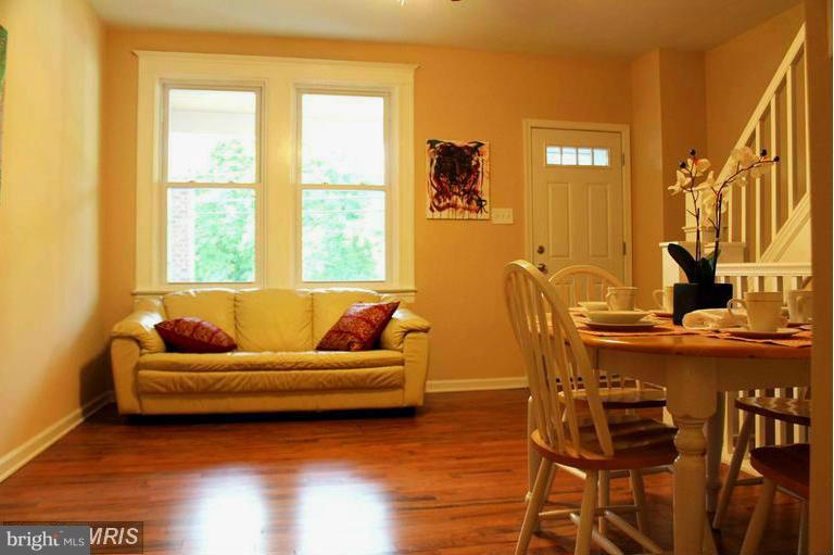 1213 West Old Cold Spring Lane Baltimore, MD 21211 - Photo 4 of 15 a living room with furniture and a window