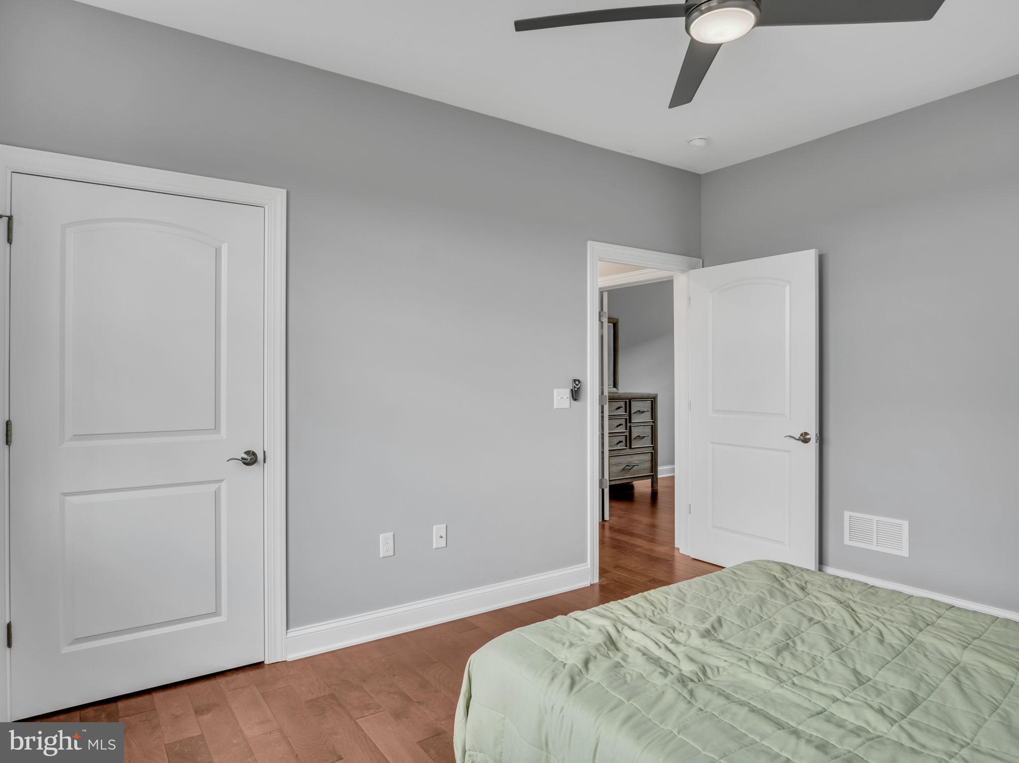 984 Pine Road Carlisle, PA 17015 - Photo 36 of 70 a bedroom with a bed and a chandelier