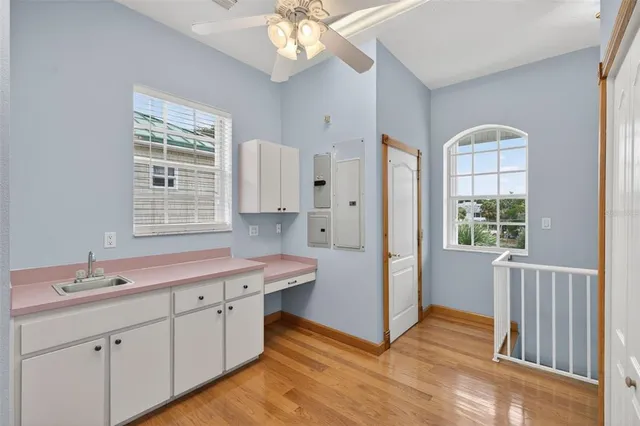a bathroom with a granite countertop sink a toilet and a shower