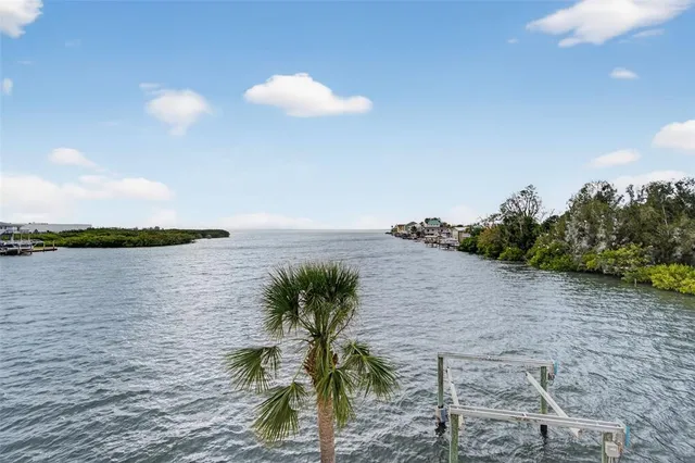 a living room with furniture large window and flat screen tv
